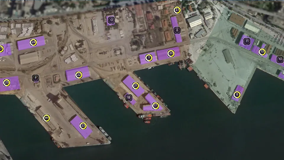 Satellite view of port piers with the controlled buildings highlighted and numbered.